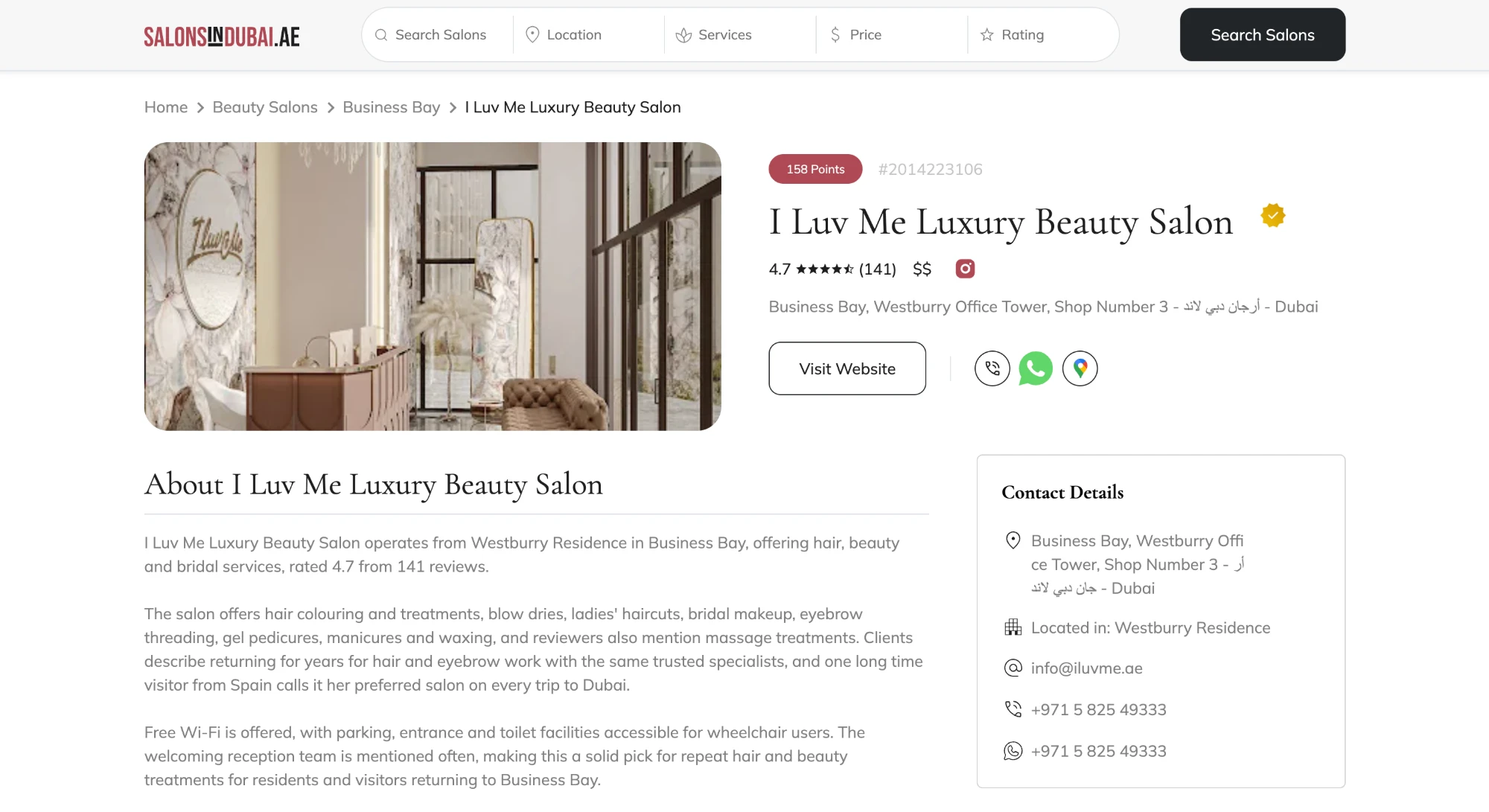 A single salon listing on SalonsInDubai.ae showing a 158 points badge and a verified mark beside the name, with rating, price band, address, website and contact details